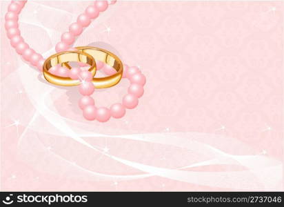 Wedding rings on pink