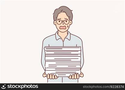 Weeping businessman with bunch of paperwork is suffering from paperwork overload and bureaucracy. Shocked man surprised by amount of bureaucracy associated with lack of digitalization document flow . Weeping businessman with bunch of paperwork is suffering from paperwork overload and bureaucracy