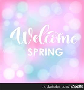Welcome Spring. Hand drawn calligraphy and brush pen lettering on light blue and fresh pink blured background with bokeh. Design for holiday greeting card, invitation, posters, sale, banners. Welcome Spring. Hand drawn calligraphy and brush pen lettering on light blue sky blured background with bokeh.