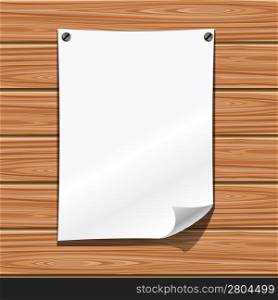 White blank paper on a wooden wall