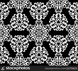 White lace ornament on a black background. Abstract floral seamless pattern. Vintage texture for fabric, tile, wallpaper or packaging.. White lace ornament on a black background.