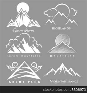 White mountain logo set. White mountain logo set isolated on grey backdrop. Vector nature labels collection