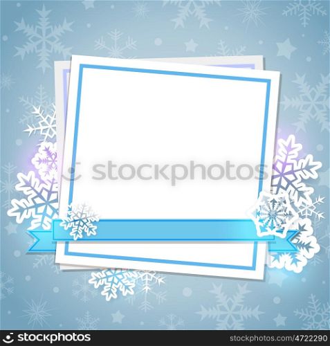 White paper card and snowflakes on a blue background. Christmas background.