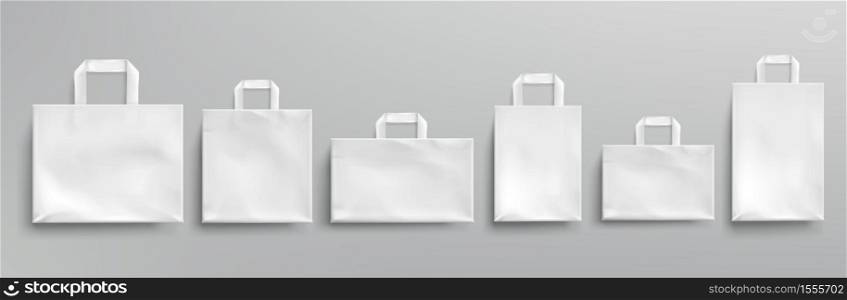 White paper eco bags different shapes. Vector realistic mockup of blank packets with handles isolated on gray background. Template for corporate design on cardboard bag for store or market. Vector mockup of white paper eco bags