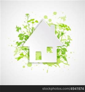 White paper house and green plants. Ecology building concept. Abstract background.