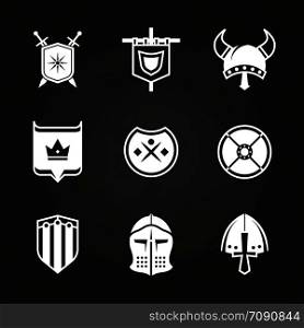 White silhouette viking knight helmets and shields icons isolated on black. Vector illustration. White silhouette viking knight helmets and shields icons