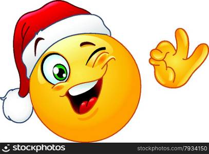 Winking emoticon wearing Santa hat