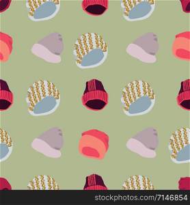 Winter headwear Illustration of knitted beanies seamless pattern on green background. Web, wrapping paper, textile, wallpaper design, background fill.. Illustration of knitted beanies seamless pattern on green background