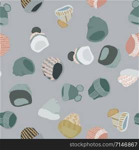 Winter headwear Knitted beanies and hats seamless pattern on grey background. Web, wrapping paper, textile, wallpaper design, background fill.. Knitted beanies and hats seamless pattern on grey background