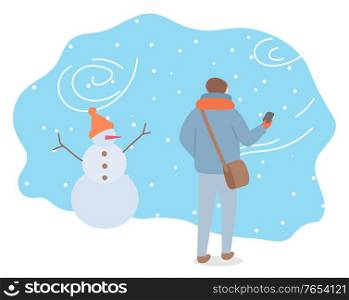 Winter snowstorm and bag weather conditions outdoors. Man wearing warm clothes passing snowman with hat. Landscape in wintertime, snowflakes and frost outside. Seasonal temperature vector in flat. Man Walking in Snowstorm, Guy and Snowman Outside