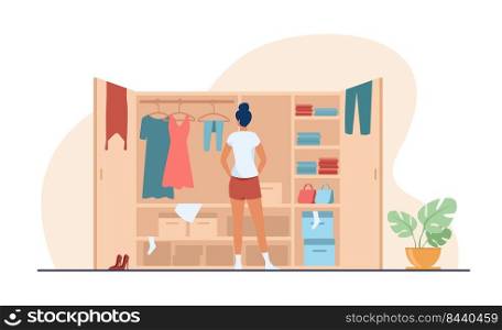 Woman choosing dress from wardrobe flat vector illustration. Young lady standing near opened closet. Pile of clothes laying on shelfs. Cartoon style. Organization and arrangement concept