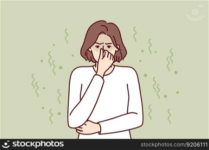 Woman closes nose in disgust at smell and toxic aroma caused by violation of hygiene rules. Young girl in white sweater feels stink and bad smell of clothes or socks in need of washing. Woman closes nose in disgust at smell and toxic aroma caused by violation of hygiene rules