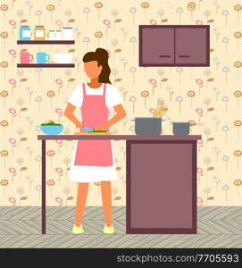 Woman cooking at kitchen. Female cutting salad at wooden board with knife. Bowl with salad, pan with raw spaghetti at kitchen table. Woman preparing food at home. Cabinet and shelves at wall. Woman cooking salad at kitchen, female preparing food for dinner, lunch, supper, natural products