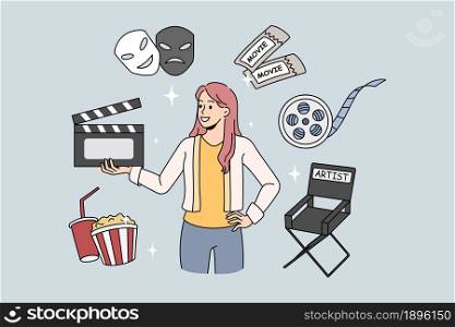 Woman director of movie production holding film clapper. Vector concept illustration with movie elements. Production director chair with cinema tickets.. Woman director of movie production holding film clapper.