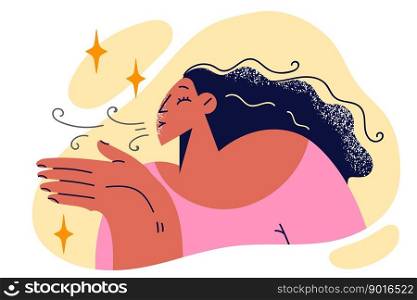 Woman does breathing exercise to support lung health and raises palm to face. Positive woman with long hair blowing on hands to warm up or enjoy pleasant breath after eating flavored chewing gum. Positive woman does breathing exercise to support lung health and raises palm to face