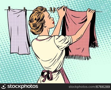 woman hangs clothes after washing housewife housework comfort. woman hangs clothes after washing housewife housework comfort retro style pop art