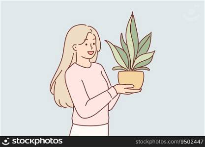 Woman holds houseplant in pot, wishing to decorate interior of apartment with plant that absorbs carbon dioxide. Happy teenager girl grows home plant and rejoices at seeing big green petals. Woman holds houseplant in pot, wishing to decorate interior with plant that absorbs carbon dioxide