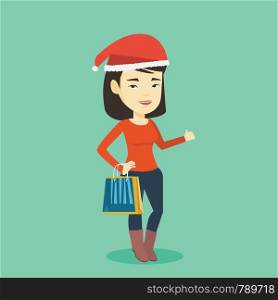 Woman in santa hat holding shopping bags. Asian woman carrying shopping bags. Girl with a lot of shopping bags. Young woman buying christmas gifts. Vector flat design illustration. Square layout. Woman in santa hat shopping for christmas gifts.