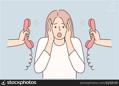 Woman is nervous about lot of phone calls and intrusive telemarketing or spam. Girl clutches head stands among telephone handsets for concept of problems with multitasking and overload at work. Woman clutches head is nervous about lot of phone calls and intrusive telemarketing or spam