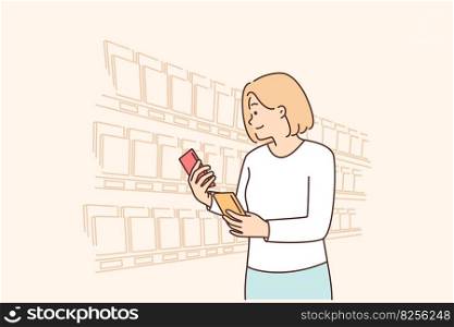 Woman looking for sweet chocolate on grocery store shelves choosing low calorie breakfast dessert. Girl stands in supermarket with chocolate bars reading composition or checking expiration date. Woman looking for sweet chocolate on grocery store shelves choosing low calorie breakfast dessert