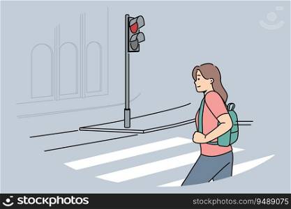 Woman pedestrian crosses road at red traffic light, putting own life and health of car drivers at risk. Girl demonstrates lack of civic consciousness by breaking rules when crossing road. Woman pedestrian crosses road at red traffic light, putting own life and health car drivers at risk