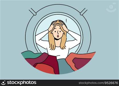 Woman peeks into washing machine and grabs head after seeing ruined clothes due to non-compliance with rules of use. Shocked housewife gets stressed, learning about washing machine breakdown. Woman housewife peeks into washing machine and grabs head after seeing ruined clothes