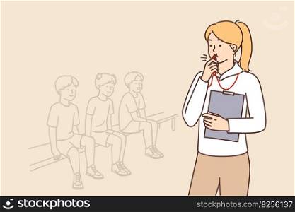Woman physical education teacher stands near teenage children sitting on bench during sports exams. Referee girl with clipboard in hand uses whistle to announce substitution in children soccer team . Woman physical education teacher stands near teenage children sitting on bench during sports exams