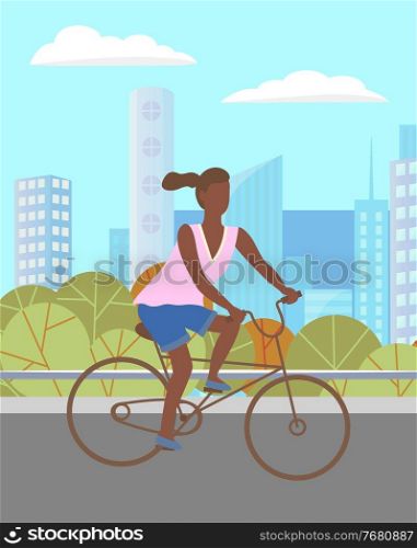 Woman riding a bicycle in the green summer park. Girl dark skinned character riding bicycle on city road against the background of tall buildings of the city landscape. Hobbies and active lifestyle. Woman riding a bicycle in the green summer park. Girl dark skinned character riding bicycle on road