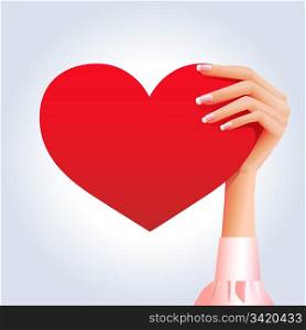 Woman&rsquo;s hand holding deep red heart