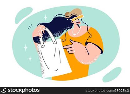 Woman shopaholic holds reusable bag for going to supermarket and smiles calling for abandonment of plastic. Fashionable shopaholic girl uses shopping bag made from recycled materials. Woman holds reusable bag for going to supermarket and smiles calling for abandonment of plastic