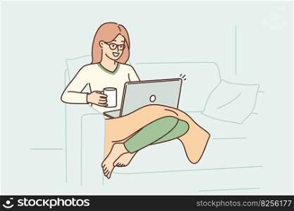 Woman sits in armchair with laptop on lap and drinks coffee enjoying relaxation in cozy home environment. Girl with plaid works via Internet in laptop for customers from freelance exchange. Woman sits in armchair with laptop on lap and drinks coffee enjoying relaxation in cozy home