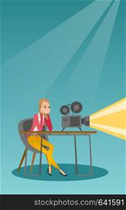 Woman sitting near a film projector in the room of projectionist. Caucasian projectionist showing a new film. Young projectionist at work. Vector flat design illustration. Vertical layout.. Caucasian projectionist showing a new film.