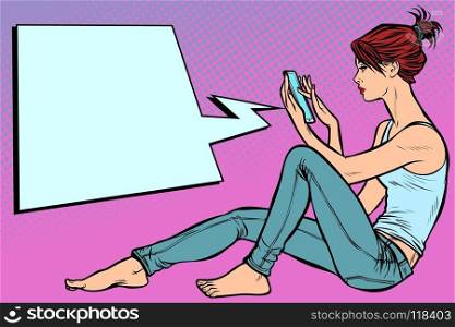 Woman sitting on the floor and reading smartphone. Pop art retro vector illustration kitsch vintage. Woman sitting on the floor and reading smartphone