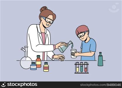 Woman teacher of chemistry teaches boy to conduct laboratory experiments and mix reagents in test tubes. School laboratory with flasks filled with chemical liquids for teaching children. Woman teacher of chemistry teaches boy to conduct laboratory experiments and mix reagents