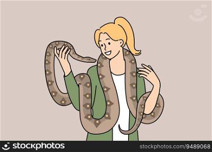 Woman with long snake around neck smiles enjoying communication with beloved pet boa constrictor. Girl holds dangerous predatory snake and does not feel fear at sight of poisonous python. Woman with long snake around neck smiles enjoying communication with beloved pet boa constrictor