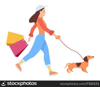 Woman with shopping bags in her hands goes after purchases. Young beautiful fashion shopper girl isolated on white background. Sale advertising. Female character is walking with the dog on the street. Woman with shopping bags in her hands. Young fashion shopper girl is walking with the dog