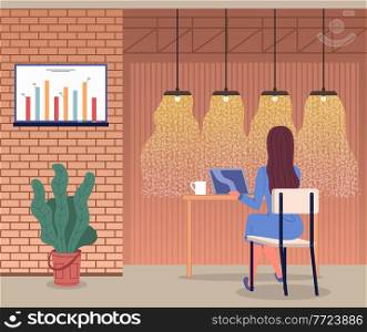 Woman working with laptop sitting in cafe. Businesslady has coffee break, cup with drink at table. Graphic at digital board at wall. Stylish interior design of cafe with lamps and pot with plant. Woman working with laptop sitting in cafe, businesslady has coffee break, cup with drink at table
