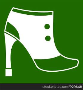 Women boots icon white isolated on green background. Vector illustration. Women boots icon green