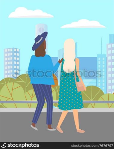 Women walking down the street. Meeting of girlfriends outdoor. Two friends women walking in city against the background of the cityscape of tall buildings. Female with bag and in hat summertime. Women walking down the street. Meeting of girlfriends outdoor. Two friends women walking in city