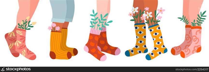 Womens legs in socks. Different cotton patterned products with spring flowers. Fashionable colors wear. Female feet in casual stockings with leaves and blossoms. Vector girly clothing elements set. Womens legs in socks. Different cotton patterned products with spring flowers. Fashionable colors wear. Feet in casual stockings with leaves and blossoms. Vector clothing elements set