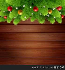 Wooden background with branches of Christmas tree . Wooden background with branches of Christmas tree and baubles