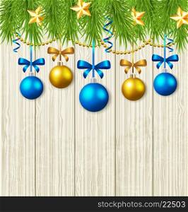 Wooden Christmas background with green fir branches, stars and blue baubles
