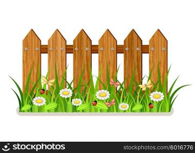 Wooden fence with grass and flowers