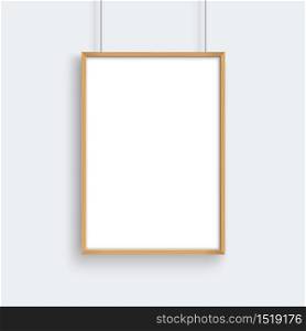Wooden frame with poster mockup hanging on gray wall.
