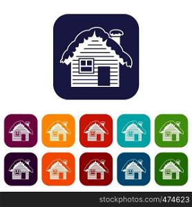 Wooden house covered with snow icons set vector illustration in flat style In colors red, blue, green and other. Wooden house covered with snow icons set