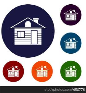 Wooden log house icons set in flat circle reb, blue and green color for web. Wooden log house icons set