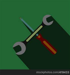 Wrench and screwdriver flat icon with shadow on a green background. Wrench and screwdriver flat icon with shadow