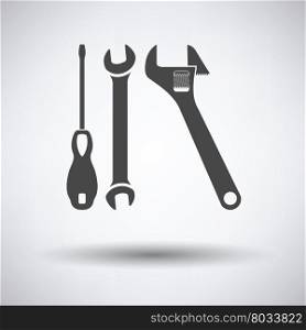 Wrench and screwdriver icon on gray background, round shadow. Vector illustration.
