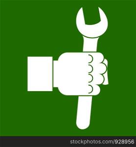 Wrench tool in man hand icon white isolated on green background. Vector illustration. Wrench tool in man hand icon green