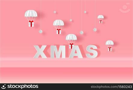 Xmas of Stage mock up Parachute gift box fly air paper cut and craft style. Merry Christmas and Happy new year. Hanging snowing with Holiday winter snow season Simple minimal pink pastel background